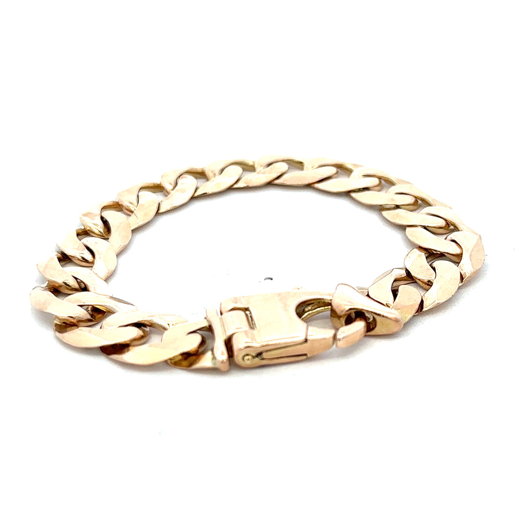 9ct yellow gold curb bracelet with links, weighing 48.1g, from Reeves and Sons, shown in a close-up image.
