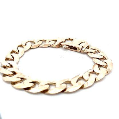 9ct yellow gold curb bracelet with a polished finish, weighs 48.1g, featuring linked oval design, by Reeves and Sons.