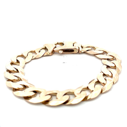 9ct yellow gold curb bracelet with a polished finish, weighing 48.1g, from Reeves and Sons, displayed on a neutral background.