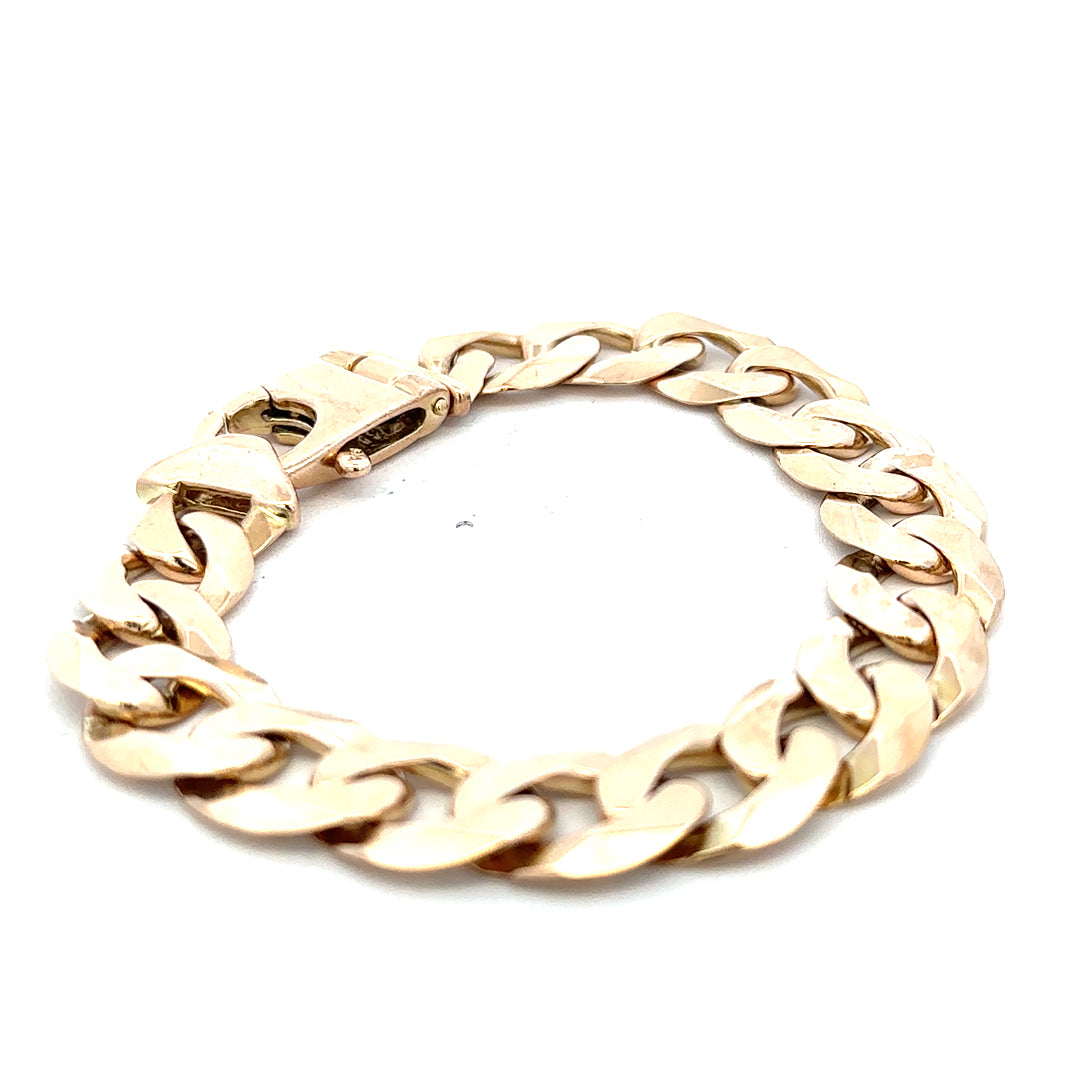 9ct yellow gold curb bracelet with a polished finish, weighing 48.1g, featuring linked oval chains from Reeves and Sons.
