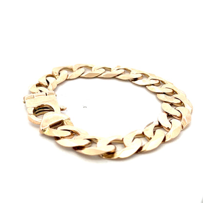 9ct yellow gold curb bracelet with detailed links, weighs 48.1g, from Reeves and Sons, showcasing a close-up of the jewelry.