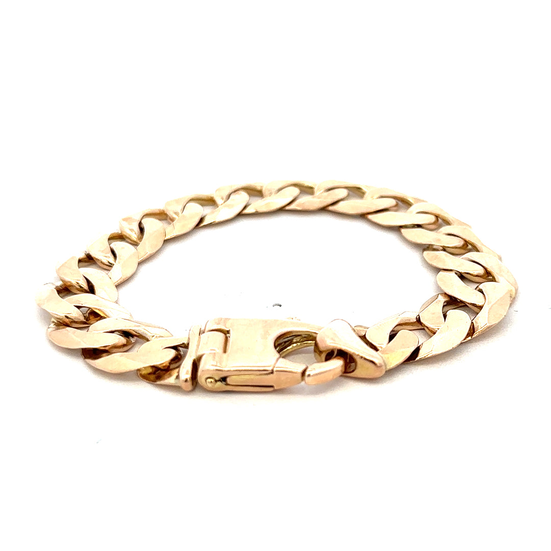 9ct yellow gold curb bracelet with intricate links, weighing 48.1g, crafted by Reeves and Sons.