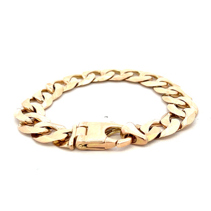 9ct yellow gold curb bracelet with intricate links, weighing 48.1g, crafted by Reeves and Sons.