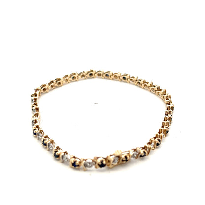 9ct yellow gold sapphire and diamond bracelet by Reeves and Sons, showcasing sparkling gemstones and elegant design.