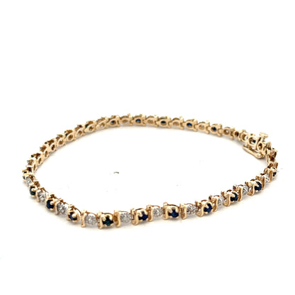 9ct yellow gold sapphire and diamond bracelet by Reeves and Sons, featuring sparkling gemstones and elegant design.