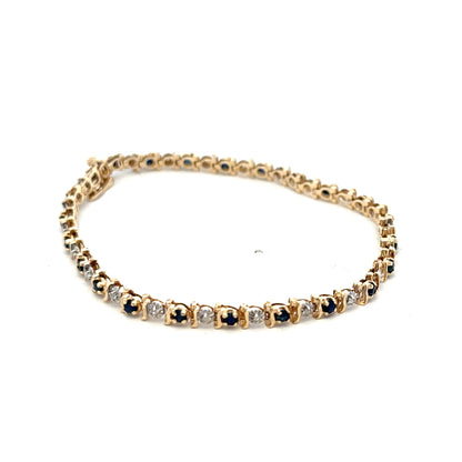 9ct yellow gold sapphire and diamond bracelet with intricate design, weighing 6.5g, from Reeves and Sons.