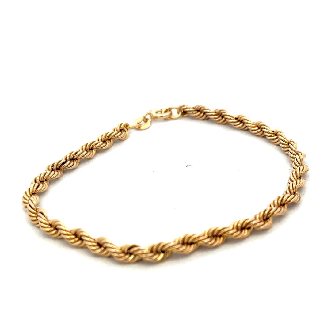9ct yellow gold rope bracelet weighing 2.4g, featuring a twisted design, from Reeves and Sons.