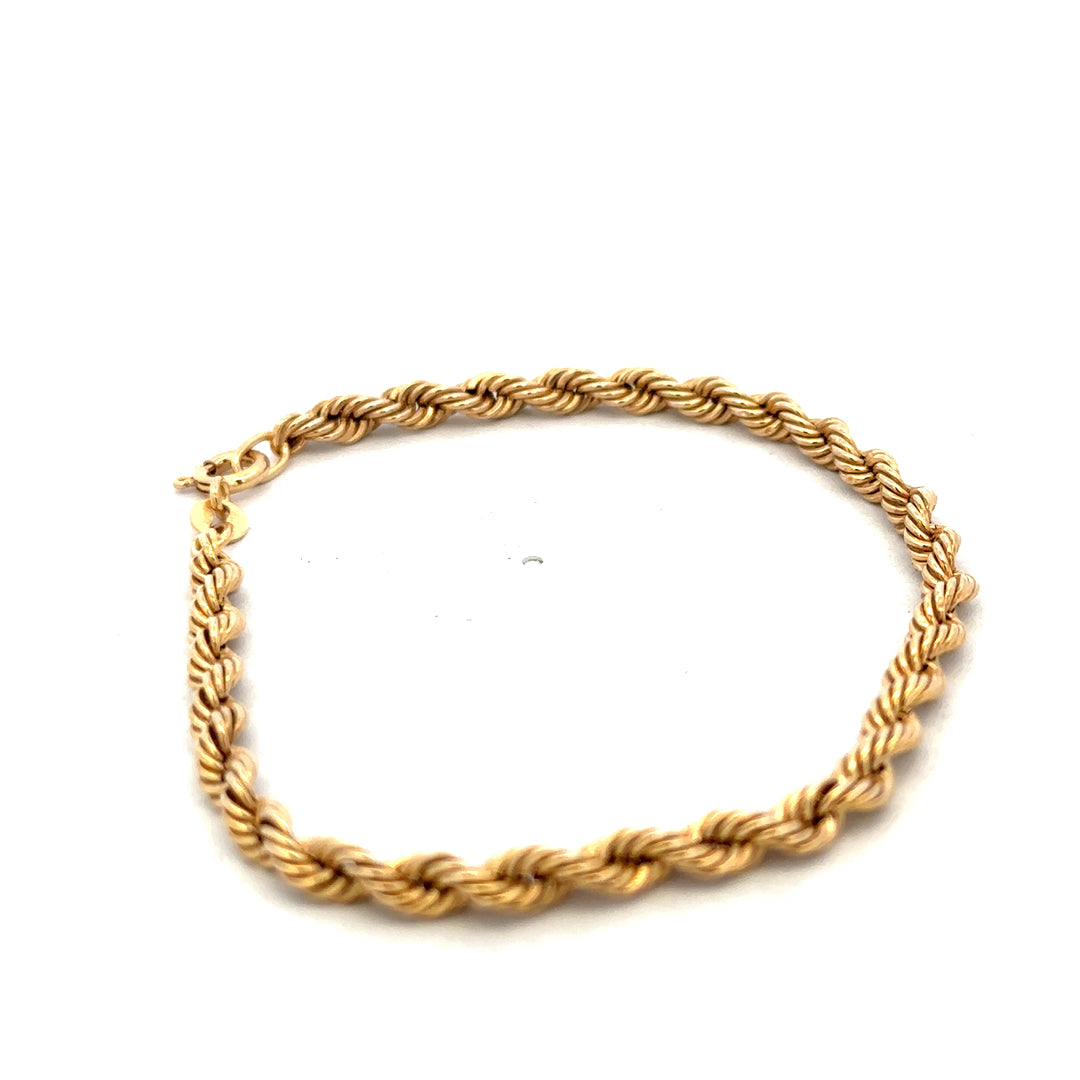 9ct yellow gold rope bracelet from Reeves and Sons, showing detailed twisted link design and polished finish.
