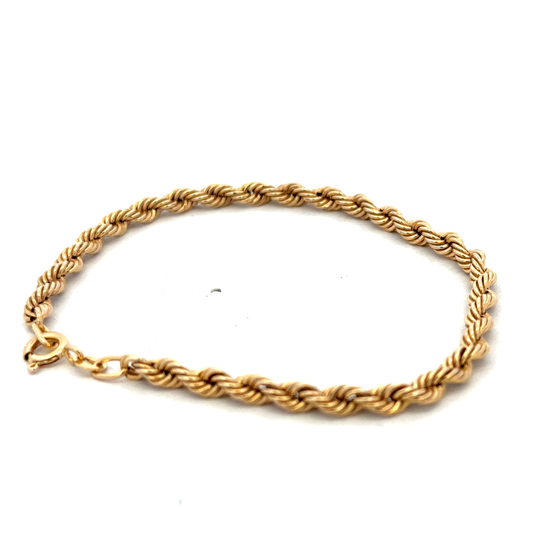 9ct yellow gold rope bracelet weighing 2.4g with a detailed twisted design, crafted by Reeves and Sons.