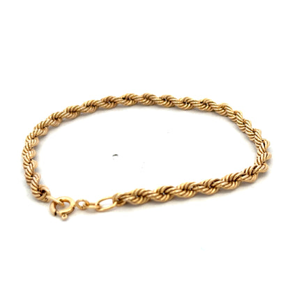 9ct yellow gold rope bracelet weighing 2.4g from Reeves and Sons, featuring a twisted gold design and clasp detail.