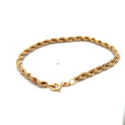9ct yellow gold rope bracelet from Reeves and Sons, showcasing its twisted design and polished finish.