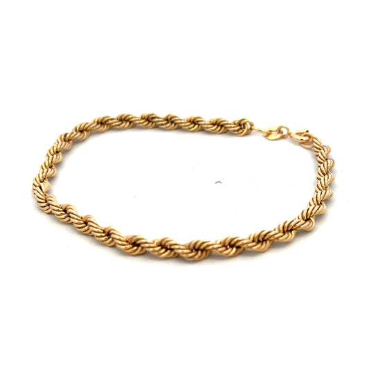 9ct yellow gold rope bracelet with a polished finish, weighing 2.4g, from Reeves and Sons.