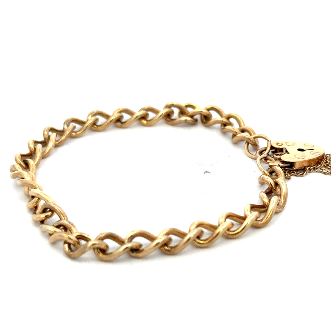 Reeves and Sons 9ct yellow gold bracelet weighing 13.2g, featuring a polished chain design displayed against a neutral background.