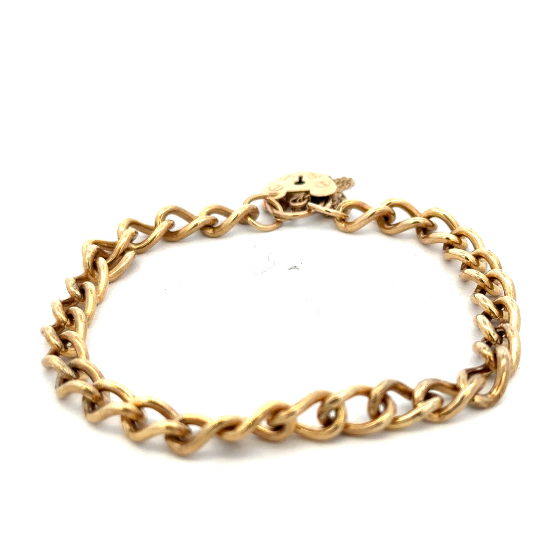 9ct yellow gold bracelet weighing 13.2g, featuring a sleek design, from Reeves and Sons.