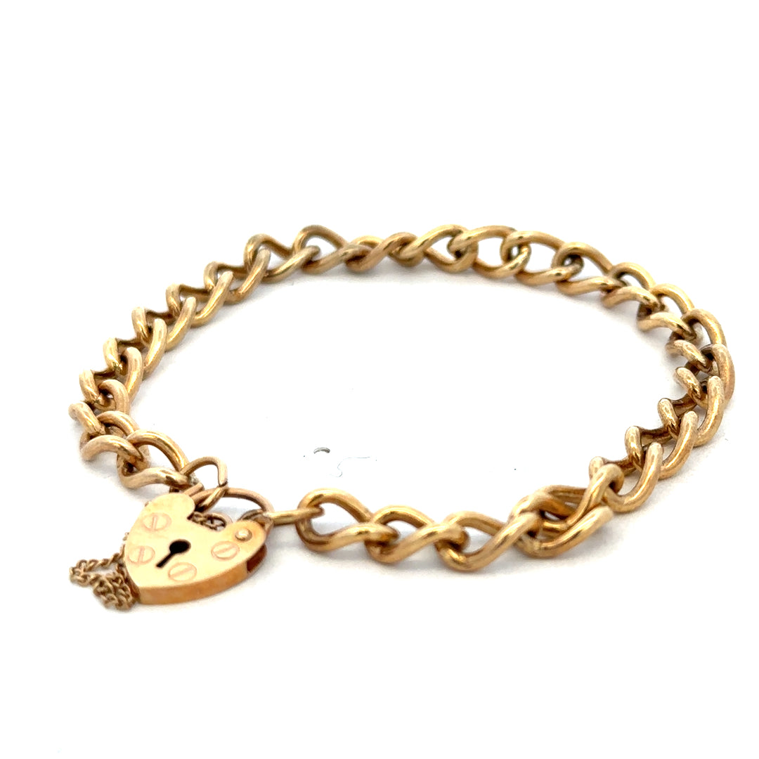 9ct yellow gold bracelet by Reeves and Sons, showcasing a sleek and elegant jewelry design with a polished finish.