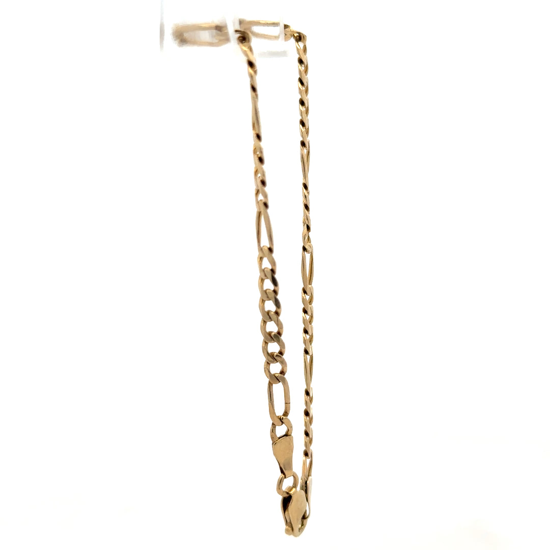 9ct yellow gold Figaro bracelet by Reeves and Sons, showcasing linked chain design and polished finish.