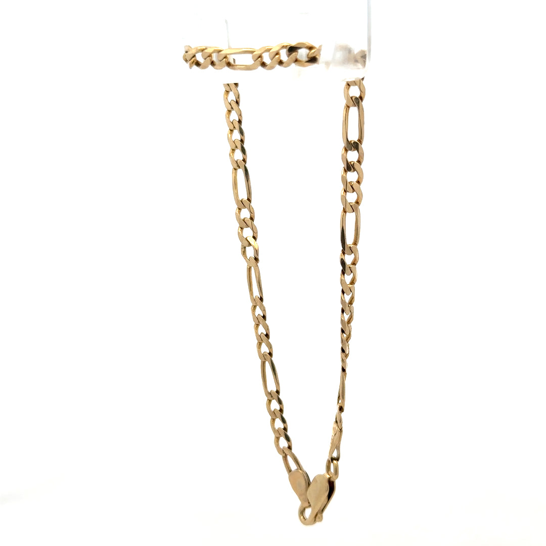 9ct yellow gold figaro bracelet with polished links, weighing 4.2g, crafted by Reeves and Sons, displayed on a neutral background.