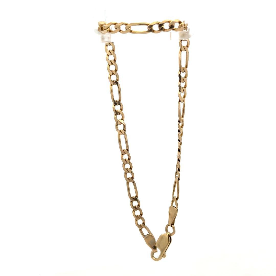 9ct yellow gold Figaro bracelet with linked chain design and polished finish, weighing 4.2g, by Reeves and Sons.