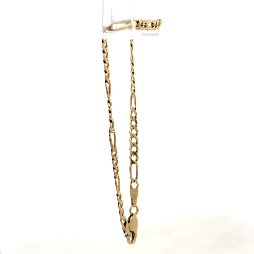 9ct yellow gold Figaro bracelet weighing 4.2g, Reeves and Sons, with interlinked oval and round chain links.
