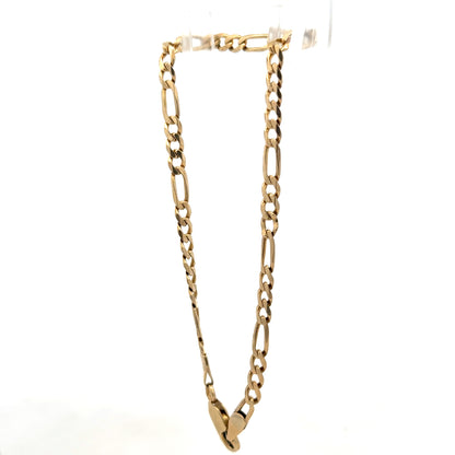 9ct yellow gold figaro bracelet by Reeves and Sons, 4.2g, featuring linked chain design, close-up view of shiny gold jewelry