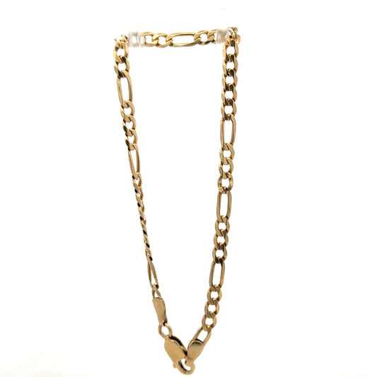 9ct yellow gold Figaro bracelet by Reeves and Sons, showing polished links and elegant design on a neutral background.