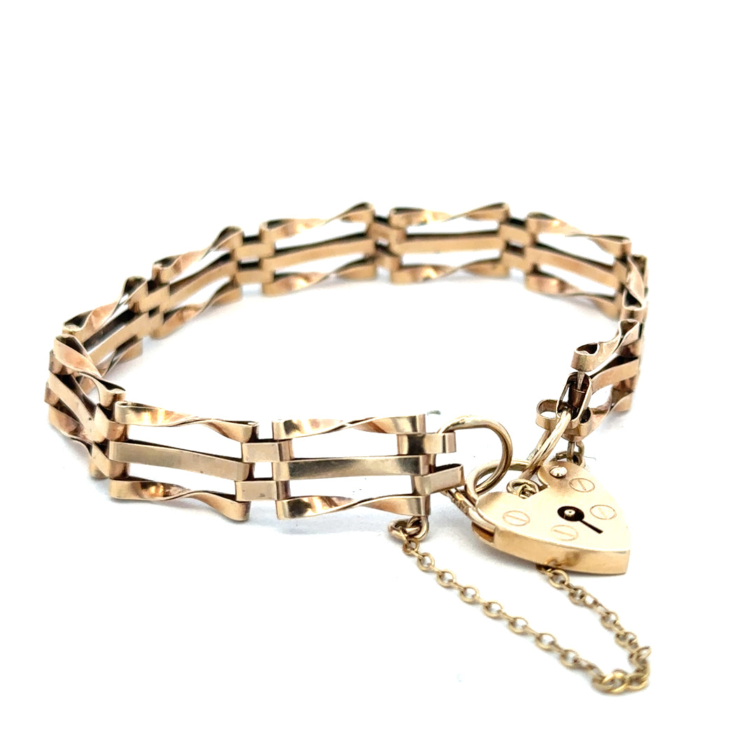 9ct yellow gold gate bracelet with a polished finish, weighing 8.4g, from Reeves and Sons.