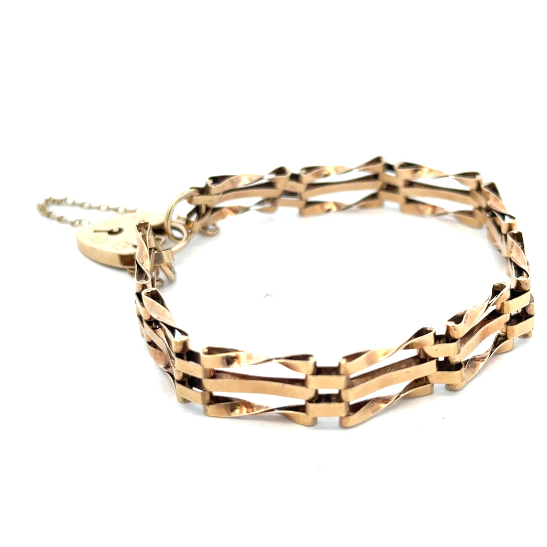 9ct yellow gold gate bracelet with intricate links, weighing 8.4g, from Reeves and Sons, showcasing its elegant design.