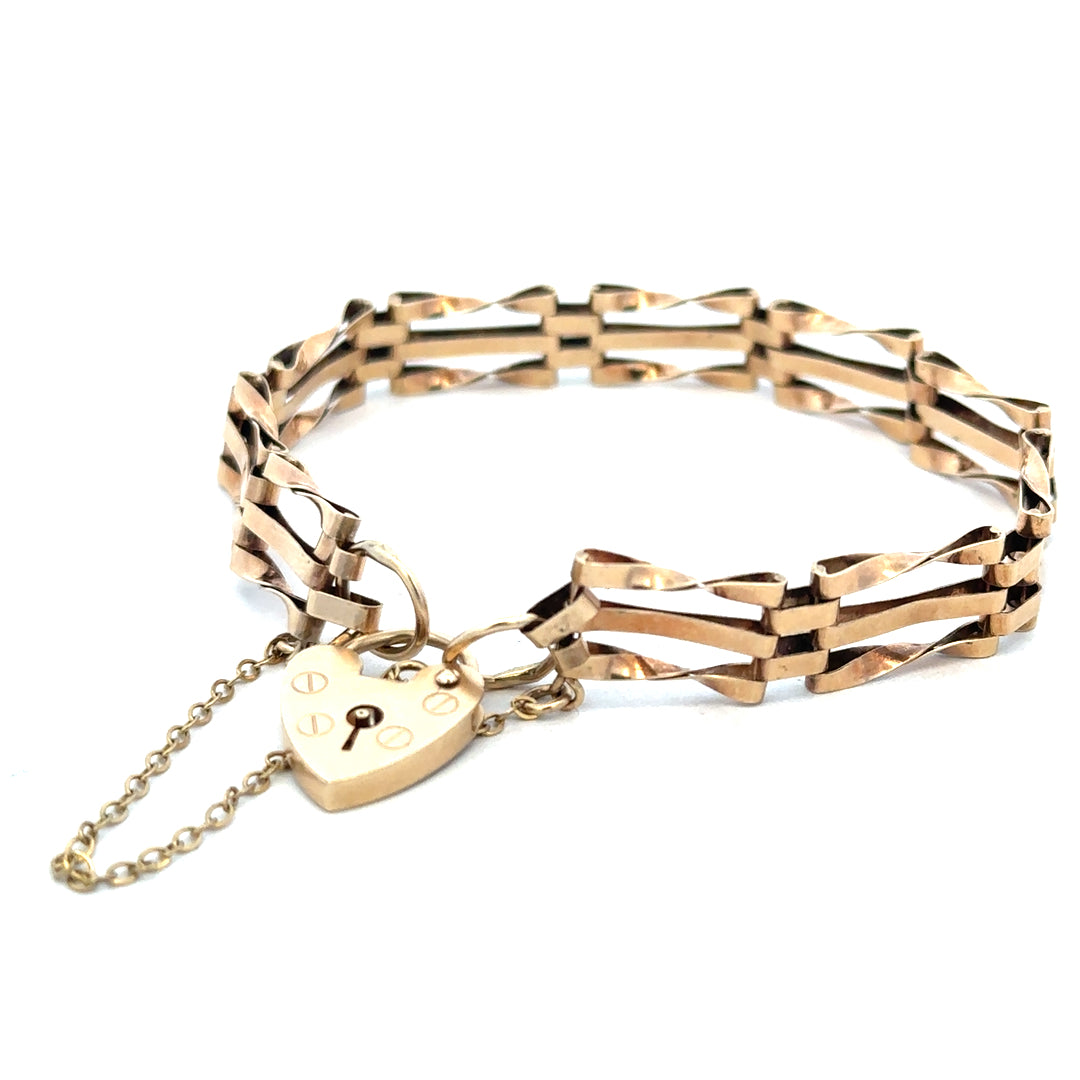 9ct yellow gold gate bracelet with a secure clasp, weighing 8.4g, crafted by Reeves and Sons, displayed on a neutral background.