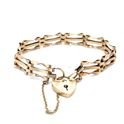 9ct yellow gold gate bracelet weighing 8.4g with linked design, crafted by Reeves and Sons.