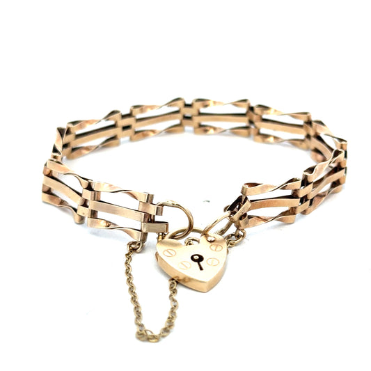 9ct yellow gold gate bracelet weighing 8.4g with linked design, crafted by Reeves and Sons.