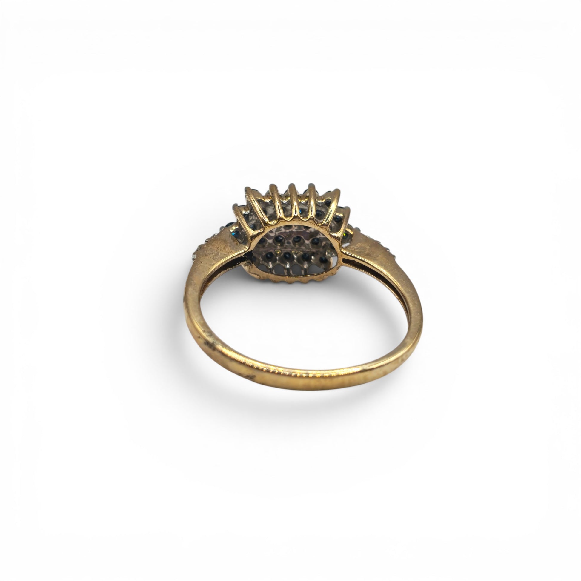9ct yellow gold diamond ring by Reeves and Sons, featuring sparkling diamonds and a polished gold band.
