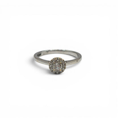 18ct white gold diamond ring by Reeves and Sons with sparkling diamonds and elegant design, shown in close-up.