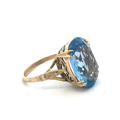 Yellow gold ring by Reeves and Sons, 9 carat gold jewelry with a polished band, shown in a close-up view.