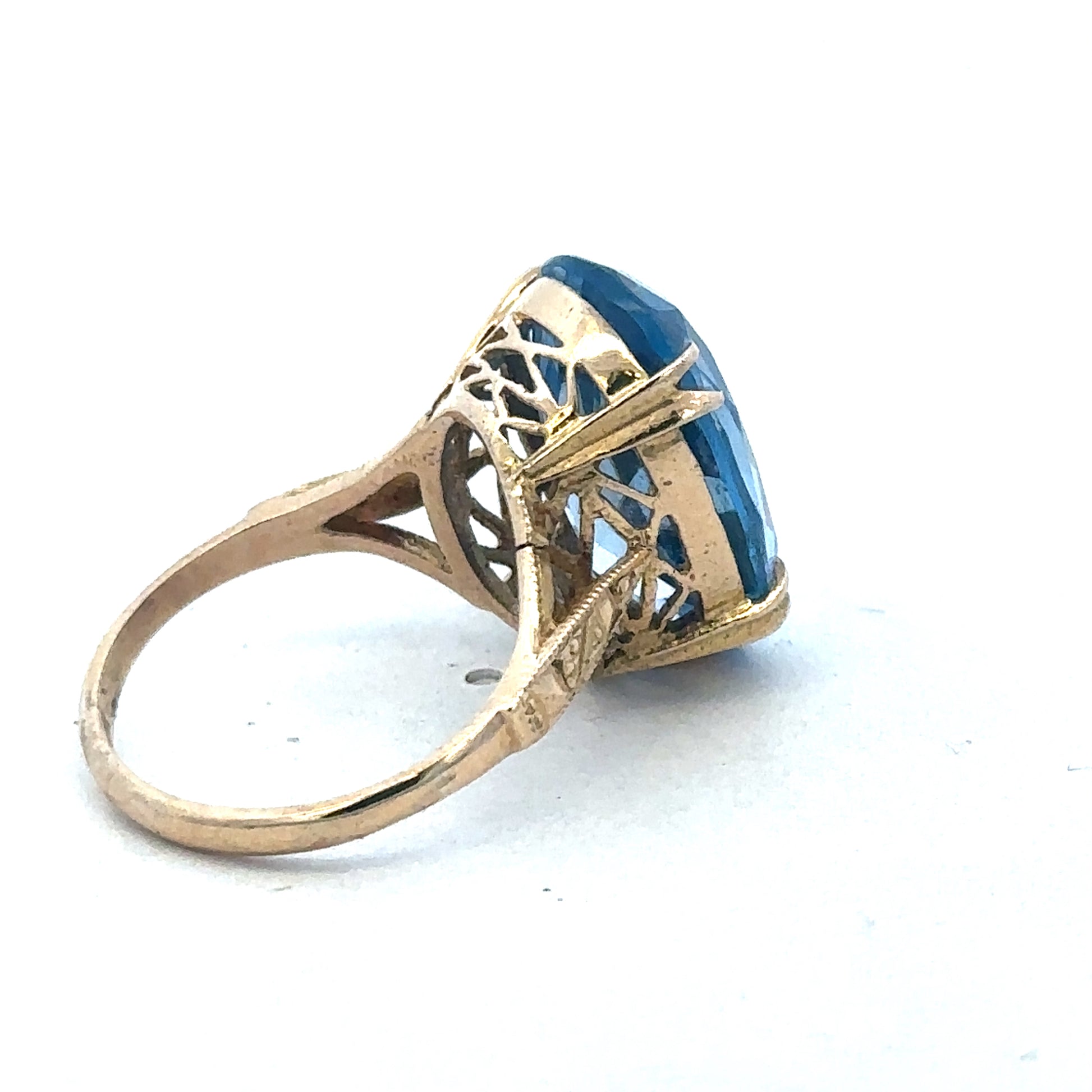 9ct yellow gold ring by Reeves and Sons, showcasing a polished band with subtle design details.