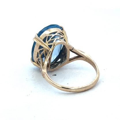 9ct yellow gold ring by Reeves and Sons, showcasing a smooth polished band with a classic design.