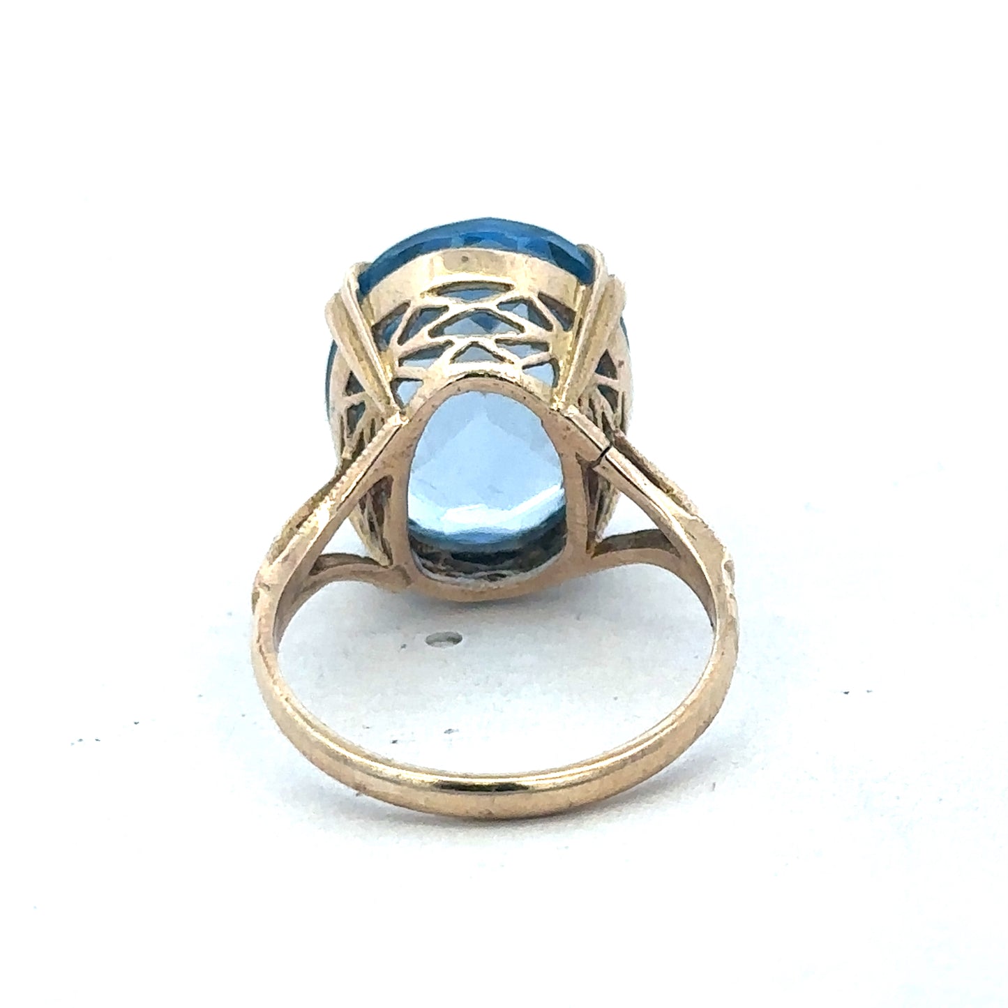9ct yellow gold ring by Reeves and Sons, showcasing a smooth polished band with subtle design details.