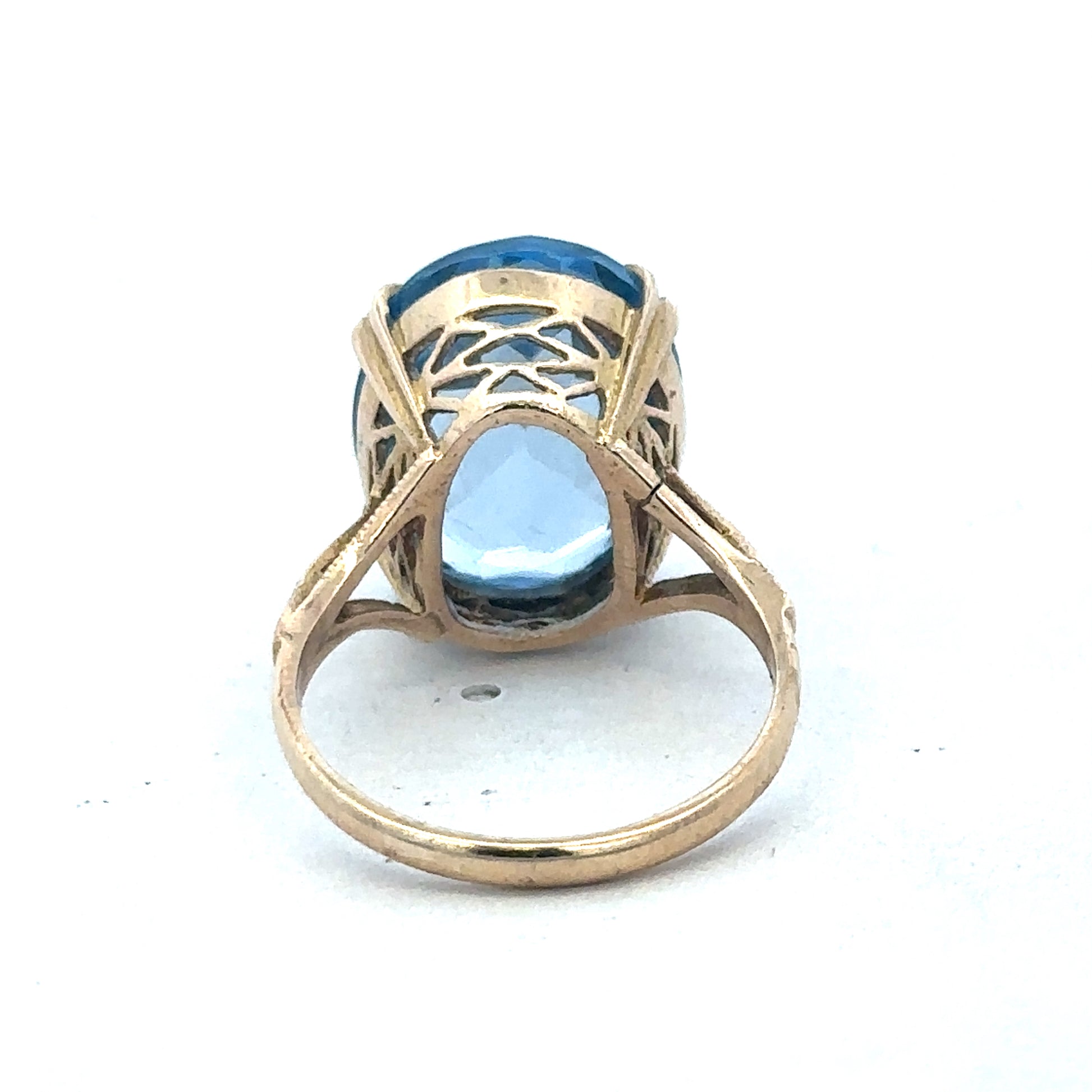 9ct yellow gold ring by Reeves and Sons, showcasing a smooth polished band with subtle design details.