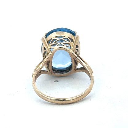 9ct yellow gold ring by Reeves and Sons, showcasing a smooth polished band with subtle design details.