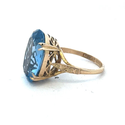 9ct yellow gold ring by Reeves and Sons, showcasing a polished band with a smooth finish and classic design.
