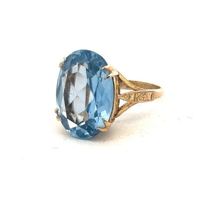 9ct yellow gold ring by Reeves and Sons featuring a smooth, polished band with a classic design.