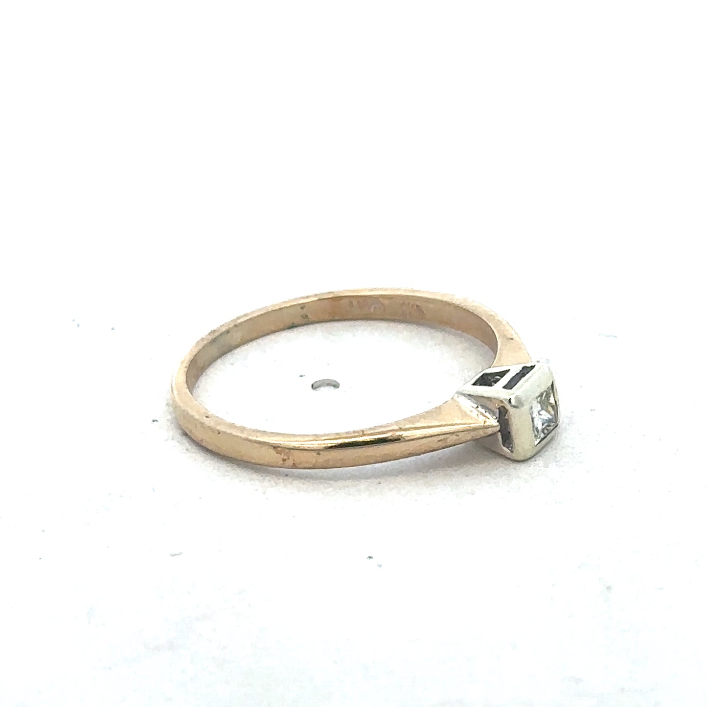 9ct yellow gold diamond ring by Reeves and Sons with sparkling diamonds, showcasing a elegant design and polished finish.