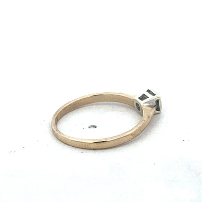 9ct yellow gold diamond ring by Reeves and Sons, showcasing a sparkling diamond set in a sleek gold band.