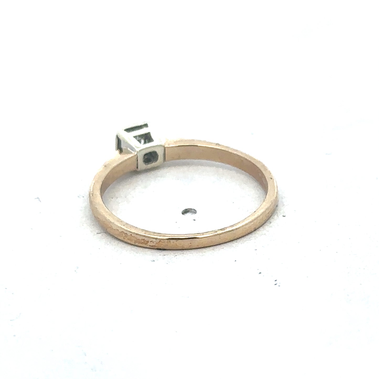 9ct yellow gold diamond ring by Reeves and Sons featuring a sparkling diamond set in a classic band.