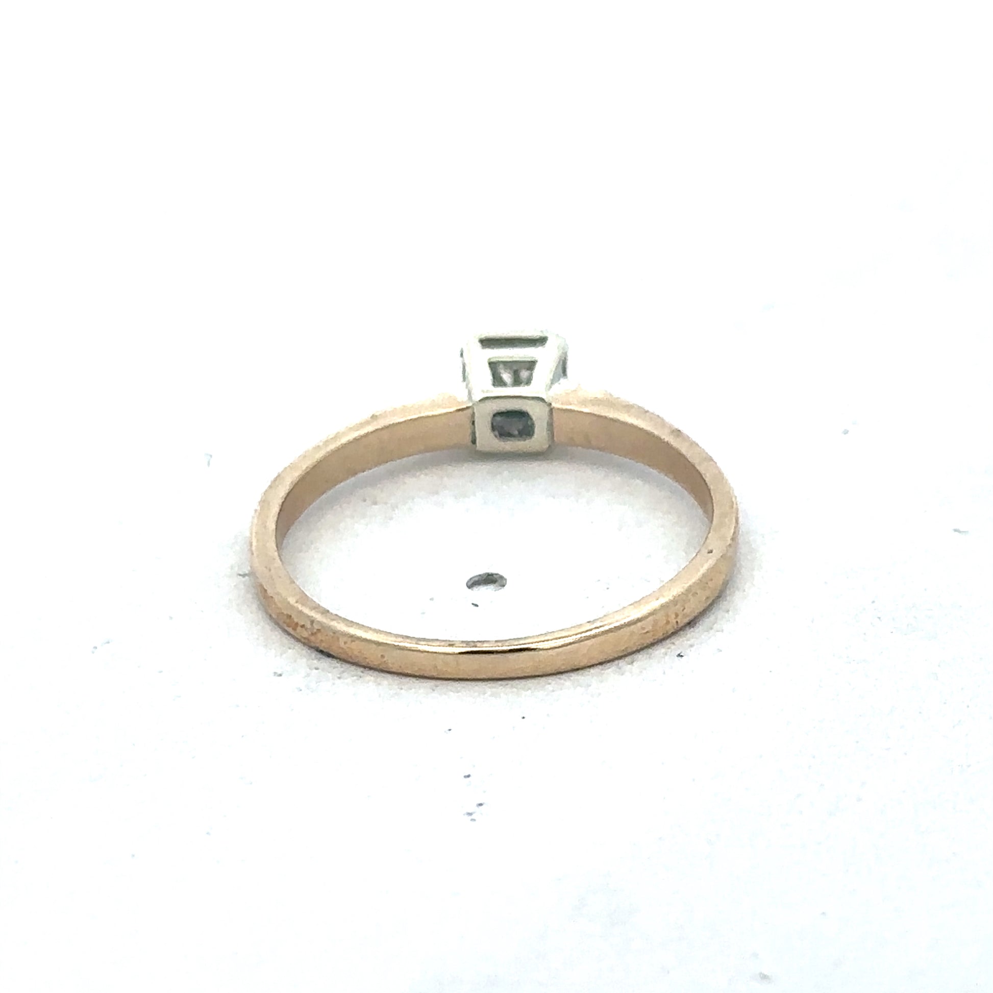 9ct yellow gold diamond ring by Reeves and Sons featuring a sparkling diamond set in a classic band.