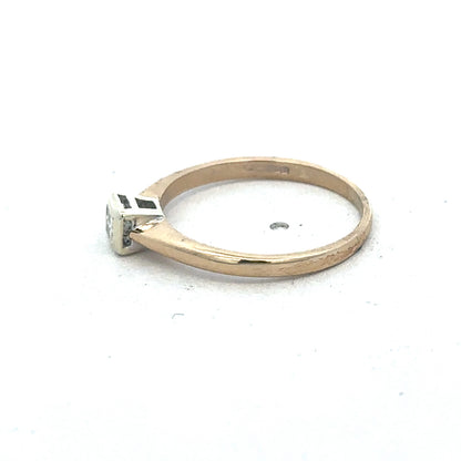 9ct yellow gold diamond ring by Reeves and Sons, showcasing a sparkling diamond set in a polished gold band.