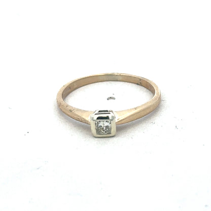 9ct yellow gold diamond ring by Reeves and Sons, featuring sparkling diamonds and elegant design, shown in close-up.