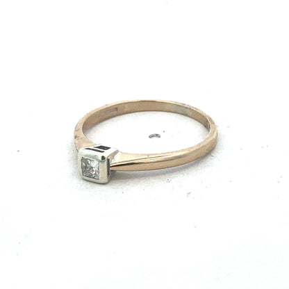 9ct yellow gold diamond ring by Reeves and Sons featuring a sparkling central diamond and elegant band design.