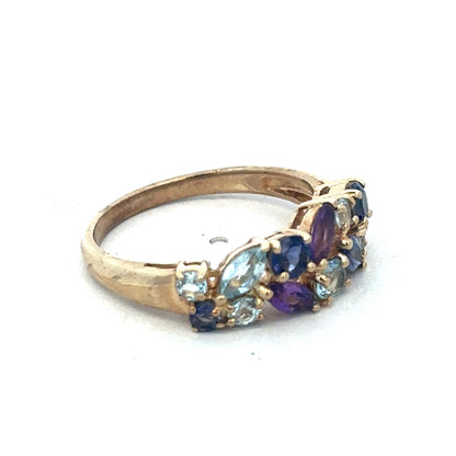 9ct yellow gold gemstone ring by Reeves and Sons, featuring a polished band and a central gemstone.