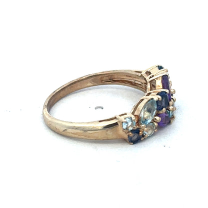 9ct yellow gold gemstone ring by Reeves and Sons featuring a sparkling central gemstone and elegant band design.