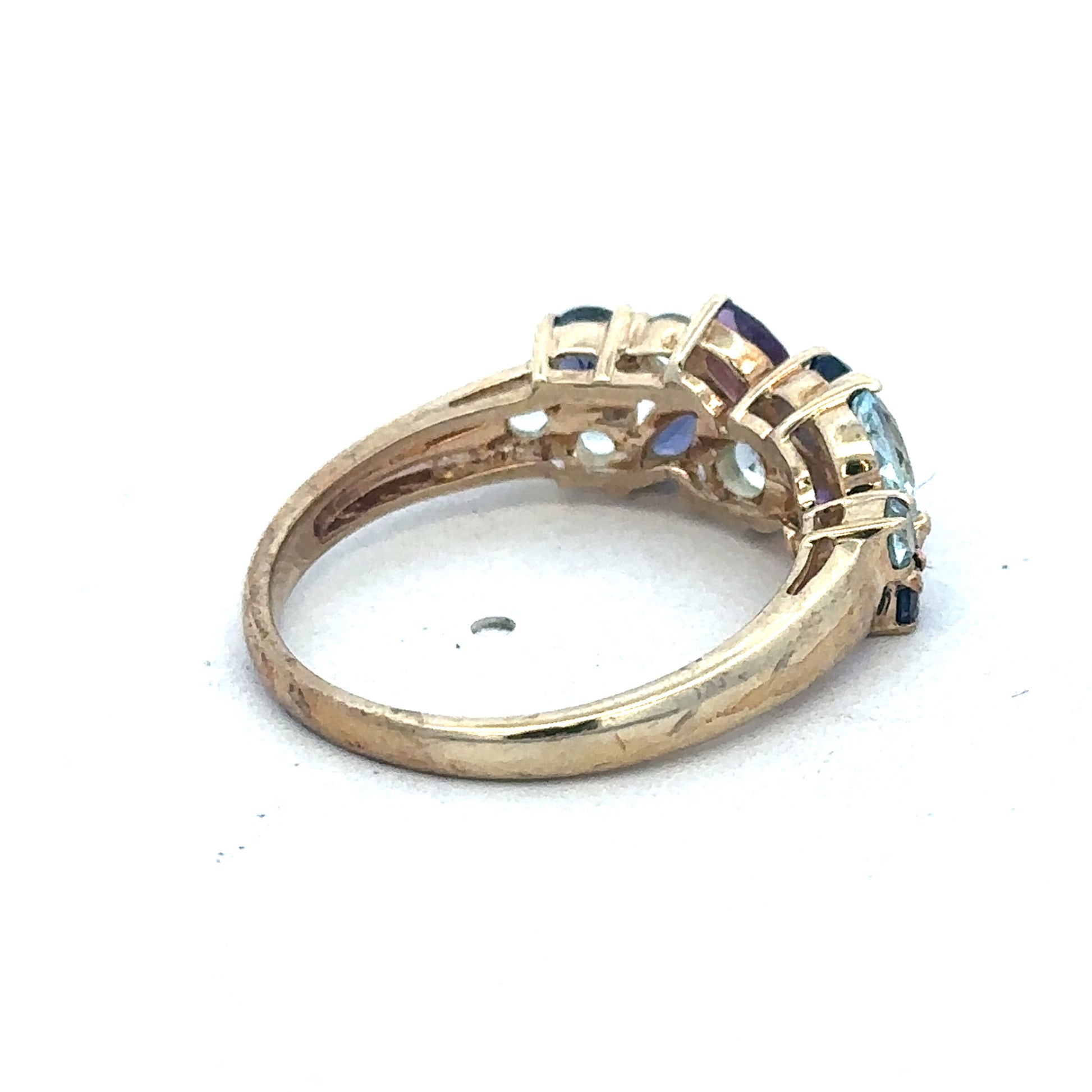 9ct yellow gold gemstone ring by Reeves and Sons featuring a sparkling gemstone set in a polished band.
